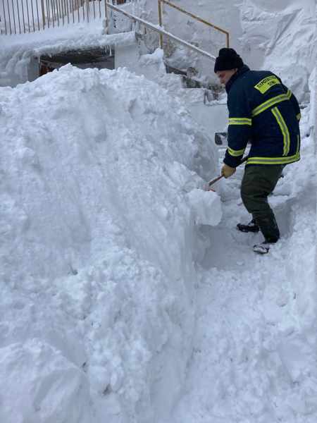 Man shovelling snow on Samothraki island