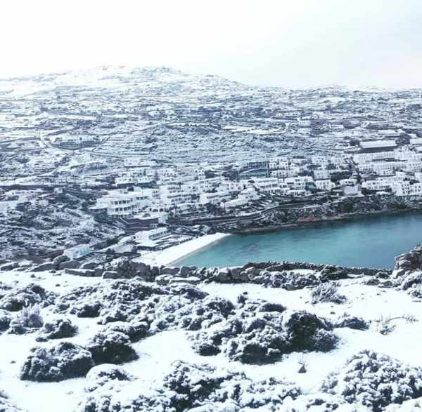 @kostis_krg Instagram photo of snow at Psarou beach on Mykonos