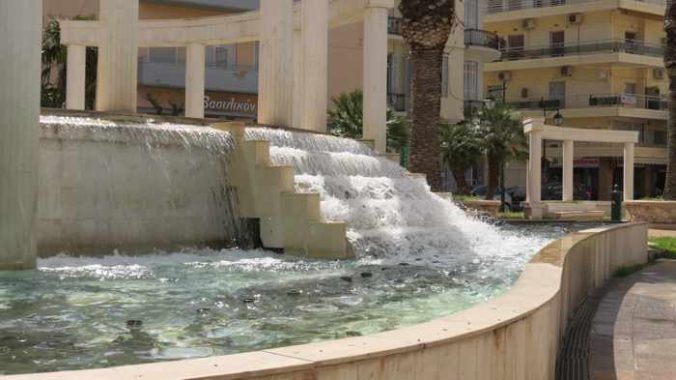 a fountain at 25 Martiou Square in Loutraki